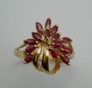 A 9 ct gold ruby bouquet design ring. Ring Size R.