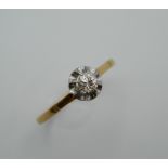 An unmarked gold diamond solitaire ring. Ring Size P.