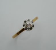 An unmarked gold diamond solitaire ring. Ring Size P.