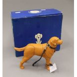 A boxed Battersea Dogs Home Sir Elton John and Mulberry model. The box 24 cm wide.