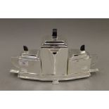 A silver plated Art Deco style tea set. 39 cm wide.