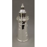 A silver plated cocktail shaker formed as a lighthouse. 36 cm high.