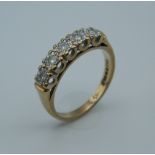 A 9 ct gold diamond ring. Ring Size L (2.