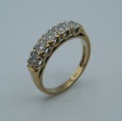 A 9 ct gold diamond ring. Ring Size L (2.