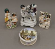 A Continental figure, pot lid and two Staffordshire figures. The former 18.5 cm high.