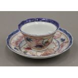 A Chinese porcelain tea bowl and saucer. The tea bowl 5.5 cm high.