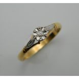 An 18 ct gold illusion set diamond solitaire ring. Ring Size P.