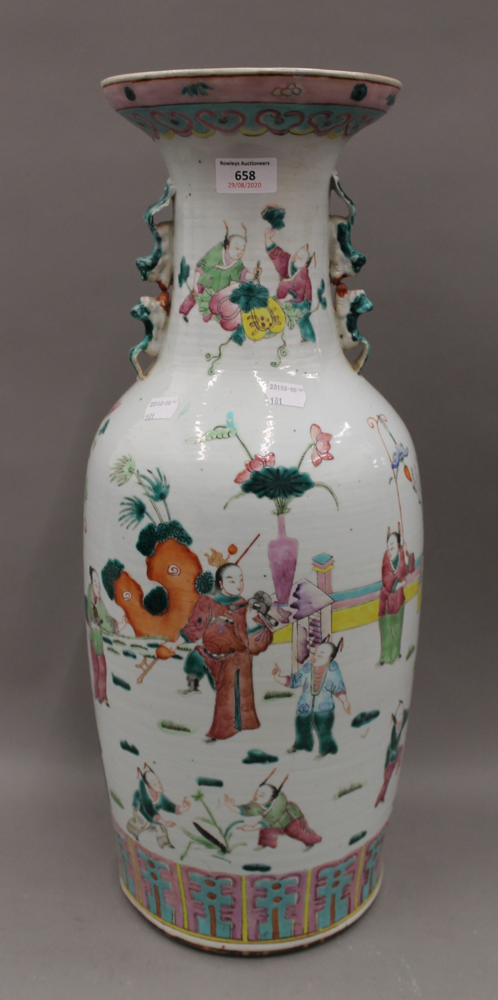 A large 19th century Chinese famille rose vase decorated with figures in various pursuits. 59.
