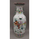 A large 19th century Chinese famille rose vase decorated with figures in various pursuits. 59.