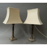 A pair of Sheffield plate candlesticks (fitted as lamps). 54.5 cm high overall.