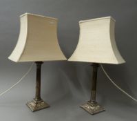 A pair of Sheffield plate candlesticks (fitted as lamps). 54.5 cm high overall.