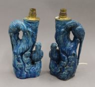 A pair of late 19th century Chinese turquoise ground pottery vases, fitted as lamps.