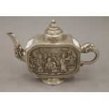 A Chinese white metal teapot. 20 cm wide.