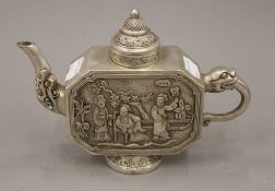 A Chinese white metal teapot. 20 cm wide.