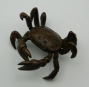 A Japanese bronze model of a crab. 5.5 cm wide.