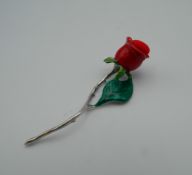 A sterling silver rose pin cushion. 5.5 cm high.