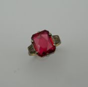 An Art Deco 9 ct gold and silver red stone ring. Ring Size M/N (3.