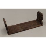 An Eastern carved wooden folding book rack. 29.5 cm long.