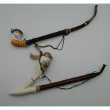 A 19th century horn and Meerschaum pipe, together with another. The former 34 cm long.