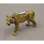 A cold painted bronze model of a tiger. 10.5 cm long.