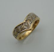 A 14 K gold diamond wishbone ring. Ring Size J (2.