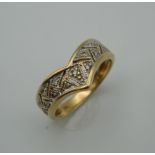 A 14 K gold diamond wishbone ring. Ring Size J (2.