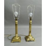 A pair of columnar form brass lamps
