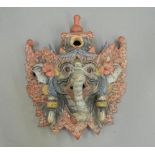 A quantity of miscellaneous Oriental items, including wall masks, a seated noble,