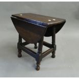 A small oak drop-leaf gate-leg table. 49 cm wide.