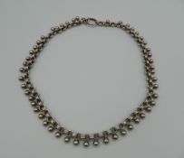 A Victorian unmarked white metal collar necklace.