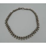 A Victorian unmarked white metal collar necklace.