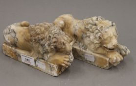 Two alabaster lions. 18 cm long x 6.5 cm wide x 9.5 cm high.