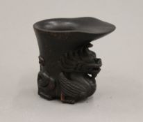 A libation cup. 8.5 cm high.