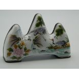 A Chinese enamel brush rest. 10 cm wide.