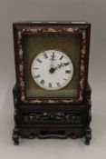 A late 19th century Chinese mother-of-pearl inlaid double fusee table clock. 37.5 cm high.