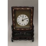 A late 19th century Chinese mother-of-pearl inlaid double fusee table clock. 37.5 cm high.