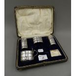 A cased silver part cruet set