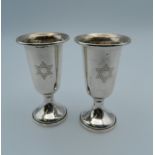 A pair of silver Jewish cups. 7.5 cm high (57.