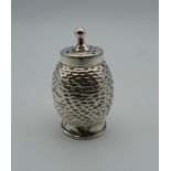 A silver sifter, possibly nutmeg. 5 cm high (10.