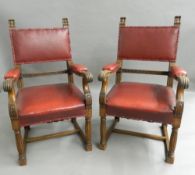 A pair of Victorian oak open armchairs. 55 cm wide.