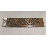 A late 19th/early 20th century oak carved panel. 64 cm wide.