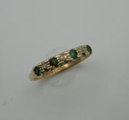 A 9 ct gold emerald and diamond ring. Ring Size N/O (1.