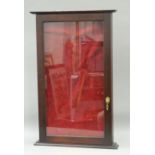 A hanging display case. 69 cm high.