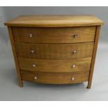 A modern bowfront chest of drawers. 96.