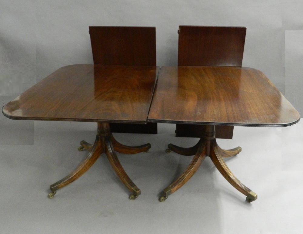A mahogany twin pedestal dining table. Approximately 272 cm long x 106 cm wide.