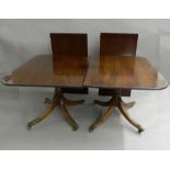 A mahogany twin pedestal dining table. Approximately 272 cm long x 106 cm wide.