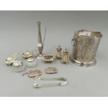 A quantity of various silver cruets, decanter labels, silver topped jars, a plated bottle coaster,