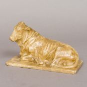 A 19th century Grand Tour alabaster animalier sculpture Formed as a cow modelled in recumbent