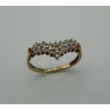 A 9 ct gold diamond wishbone ring. Ring Size L/M (1.