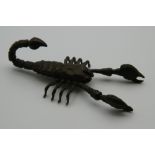 A Japanese bronze articulated model of a scorpion. 8.5 cm long.